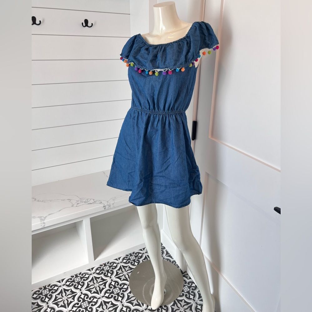Denim dress with pom poms